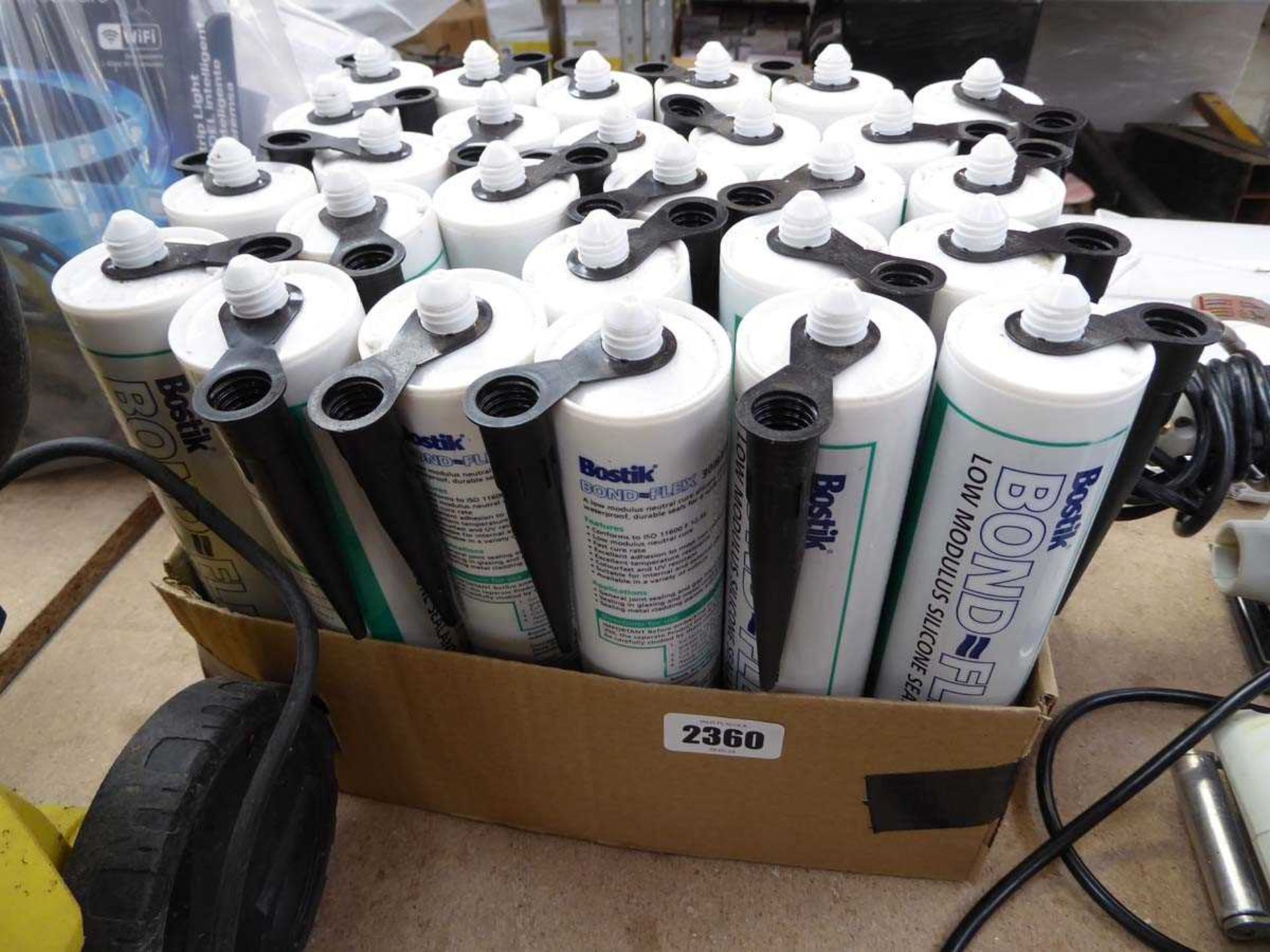 Crate containing approx. 27 tubes of Bostik Bond-Flex silicone sealant