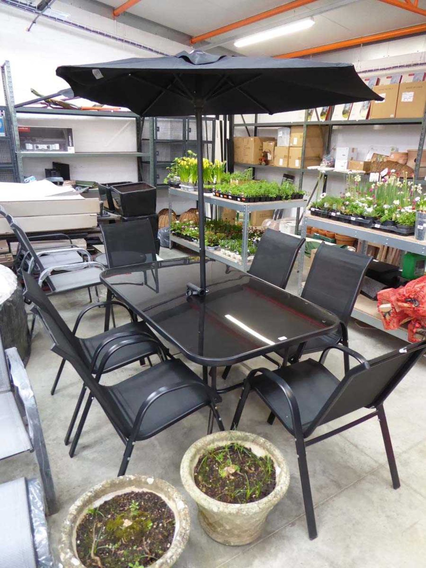 Black 8 piece outdoor garden seating set comprising rectangular glass top garden table, 6 black mesh