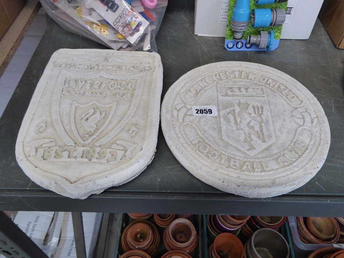 Concrete Manchester United Football Club plaque with concrete Liverpool Football Club wall plaque