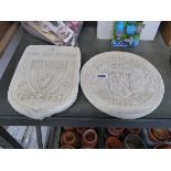 Concrete Manchester United Football Club plaque with concrete Liverpool Football Club wall plaque