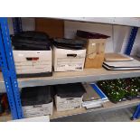 2 shelves containing mixed stationery supplies incl. staplers, hole punchers, tape guns, various