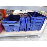Large quantity of blue stacking crates with lids