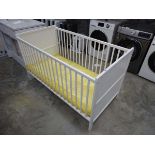 White wooden babies cot with mattress