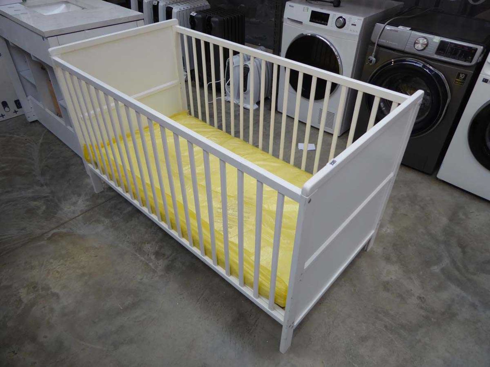 White wooden babies cot with mattress