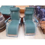 Pair of green reclining garden sunloungers