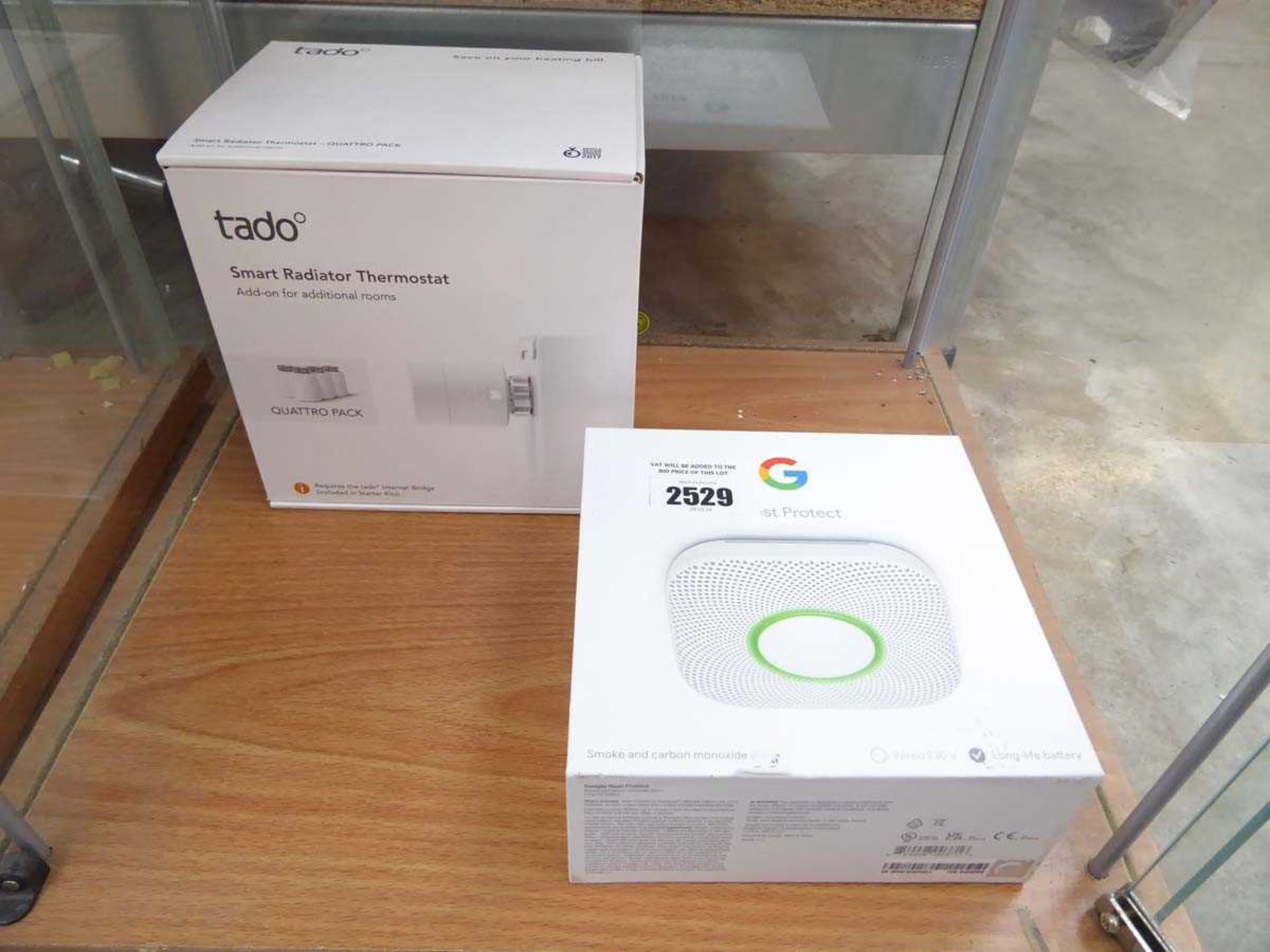 +VAT Boxed Tado Smart radiator thermostat, together with a Google Nest Protect smoke and carbon