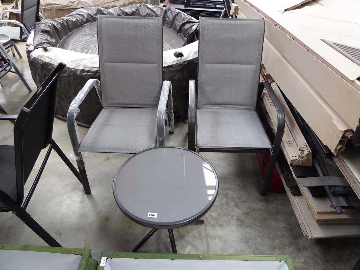 Grey aluminium 3 piece bistro set comprising 2 garden armchairs and circular glass top side table