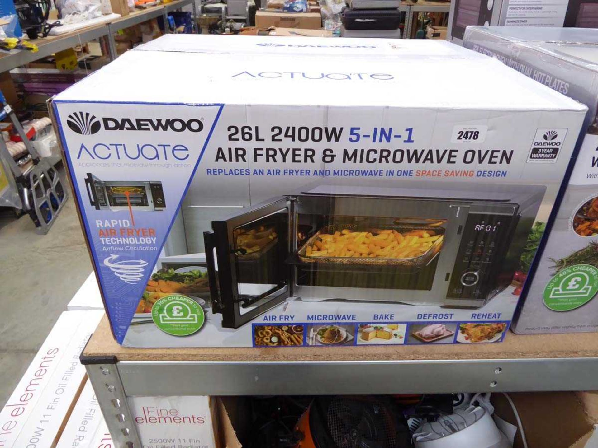 Boxed Daewoo Actuate 26L air fryer and microwave oven