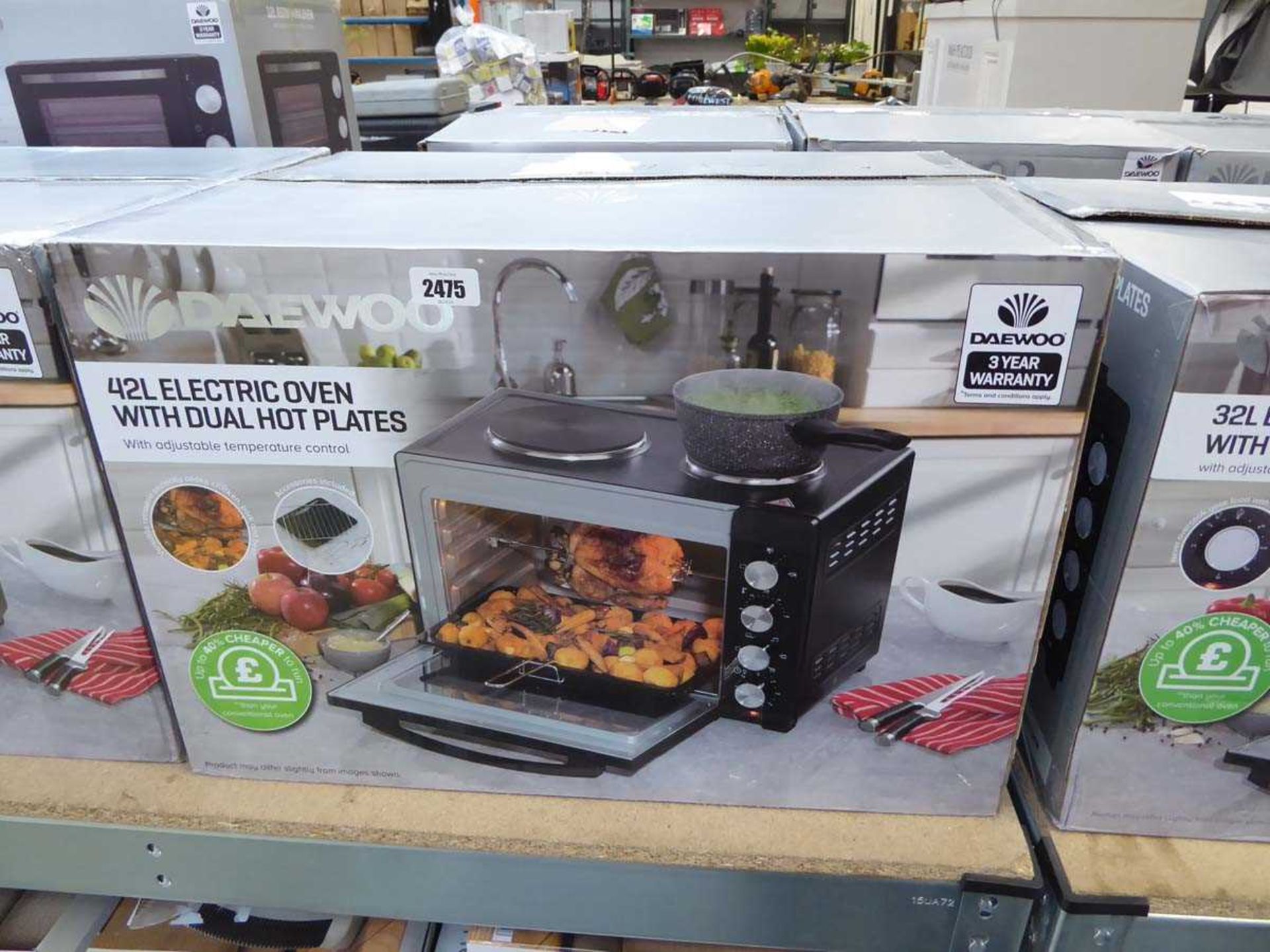 Boxed Daewoo 32L electric oven with dual hot plates