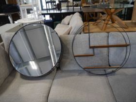 Large circular metal shelf with similar mirror