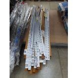 +VAT Large quantity of wall mounted shelving uprights
