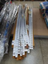 +VAT Large quantity of wall mounted shelving uprights