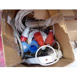 Box containing a quantity of various extension leads and sockets