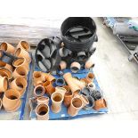 Pallet containing a large quantity of 4in. drainage parts and accessories