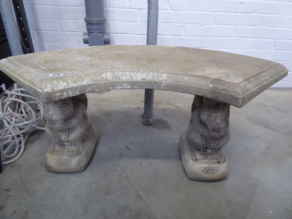 Concrete semicircular garden bench on squirrel