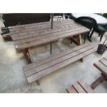 Wooden slatted picnic bench