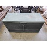Green plastic outdoor storage bench
