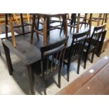 Modern black extending dining table with set of 3 black and grey upholstered dining chairs