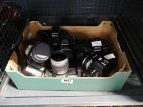 Cage containing various camera equipment, to include Nikon F501, Nikon F401, Nikon F301 etc. and