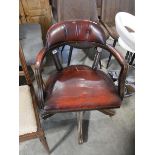 Red leather upholstered desk chair on wooden frame and 5 star support