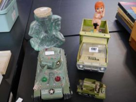 Vintage toys including a tin plate Tonka hydraulic truck, US army tank, glass sweetie jar