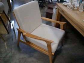 Modern beech framed easy chair with natural coloured cushions