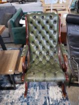 Green leather rocking chair upholstered in the Chesterfield manner