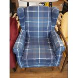 Modern blue check upholstered wing back easy chair on turned wooden supports