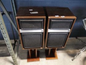 2 vintage speakers with wooden cabinets and stands (dated 1967 on the back)