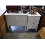 2 pieces of white furniture including a cupboard and a 3 drawer bedside