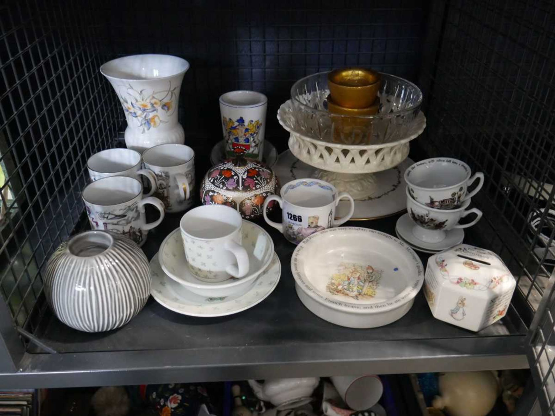 Cage containing various Royal Worcester cups, Wedgewood Peter Rabbit bowls, money boxes and other