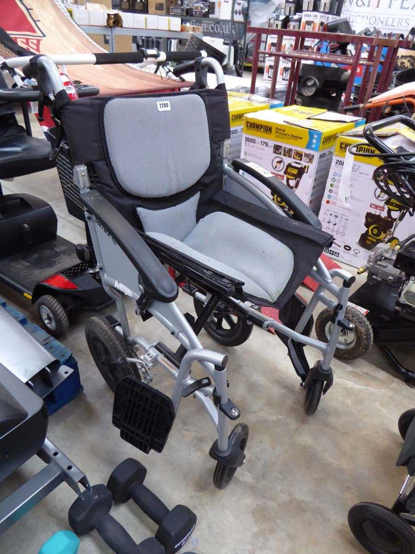 Grey folding wheelchair