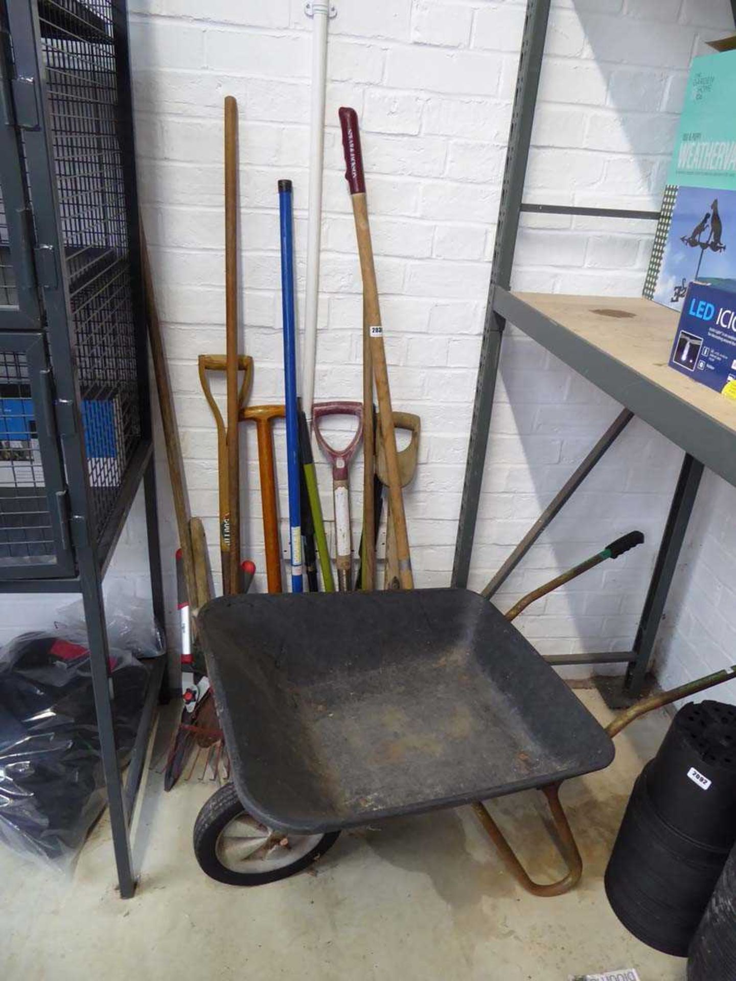 Wheelbarrow and tools incl. shears, rake, fork, etc.