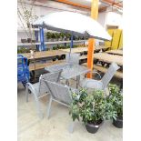 Grey garden table set with 4 chairs and umbrella