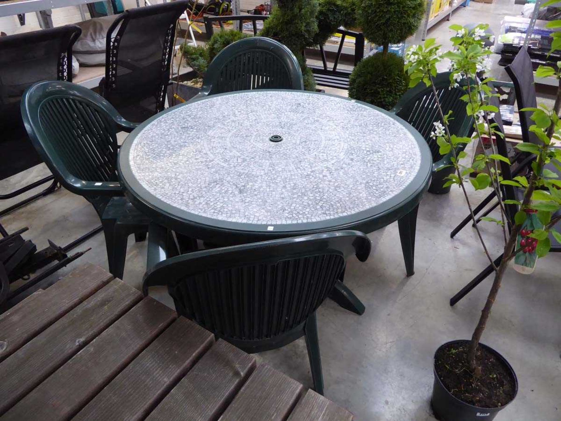 Green plastic circular garden table with mosaic effect surface and 4 matching chairs