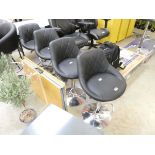 4 adjustable black bar stools on chrome supports