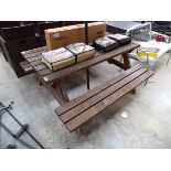 Wooden slatted picnic bench