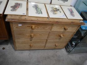 A pine chest with 6 asymmetrical drawers