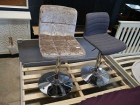 A modern metallic brown upholstered bar height stool on chrome supports