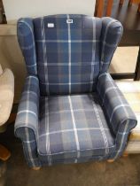 Modern blue check upholstered wing back easy chair and similar yellow check upholstered footstool