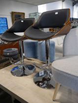 Modern pair of Eames type bent wood bar stools with black leatherette upholstered seats