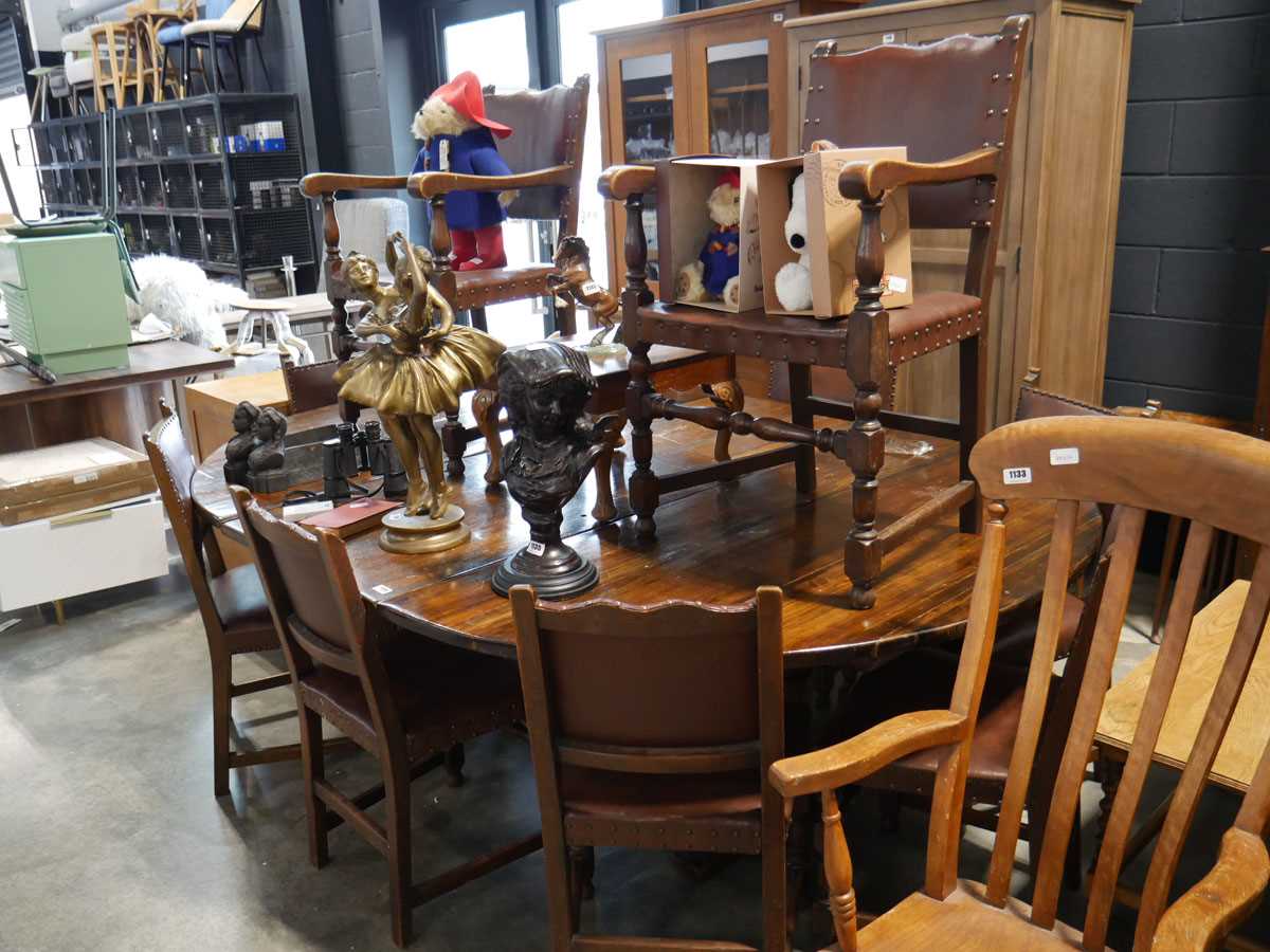 Large dark oak dining table with central leaf and 10 (8+2) oak framed brown leather upholstered