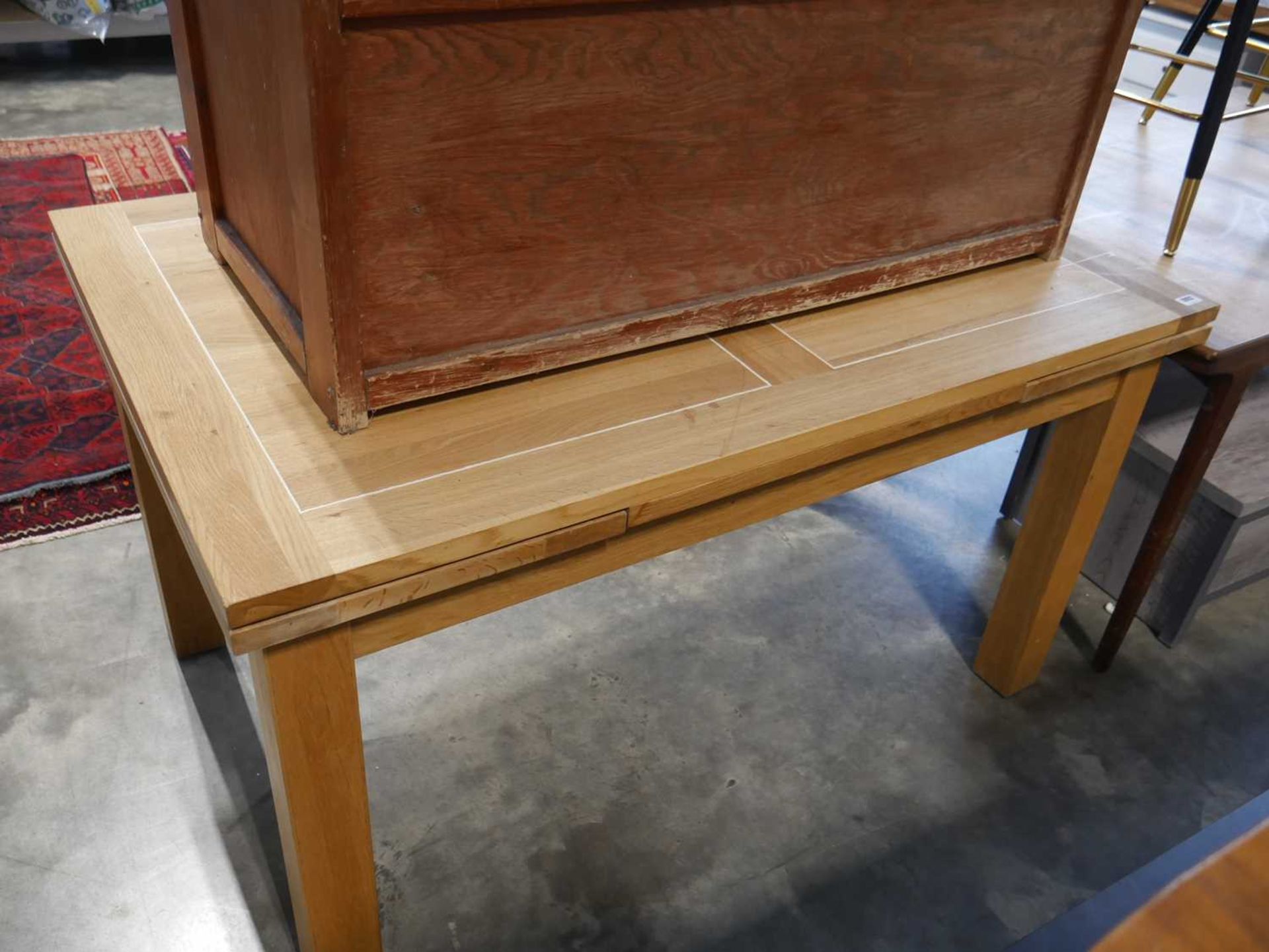 Modern light oak finish extending dining table