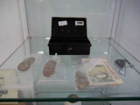 Small black tin and the contents of various coinage, including half crowns and bank notes