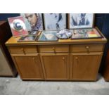 Teak finish sideboard together with a further smaller similar sideboard
