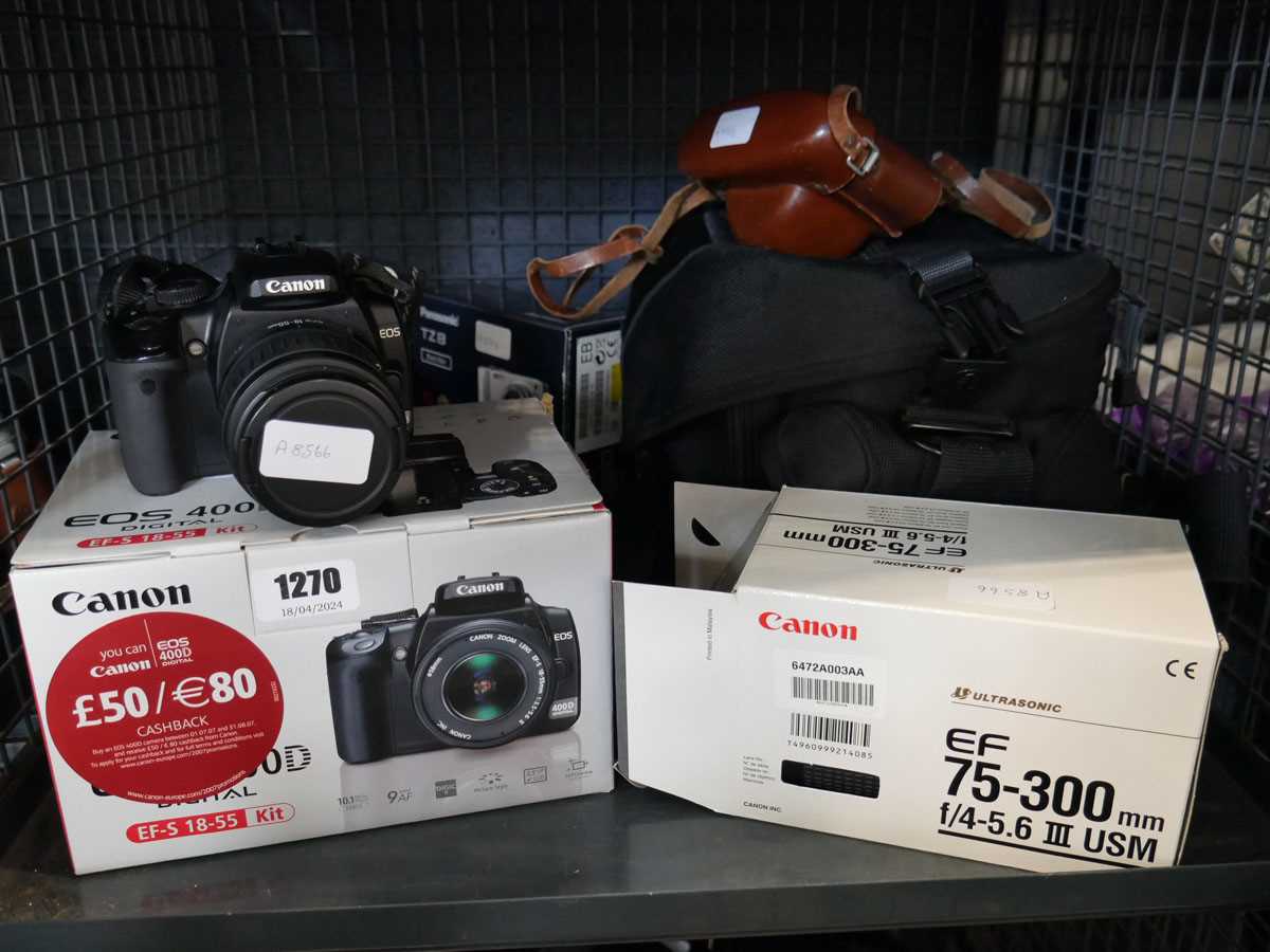 2 cages containing qty of camera equipment to include Canon EOS 400D SLR camera, Panasonic Luix