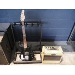 Children's electric guitar in black together with wash burn guitar amplifier