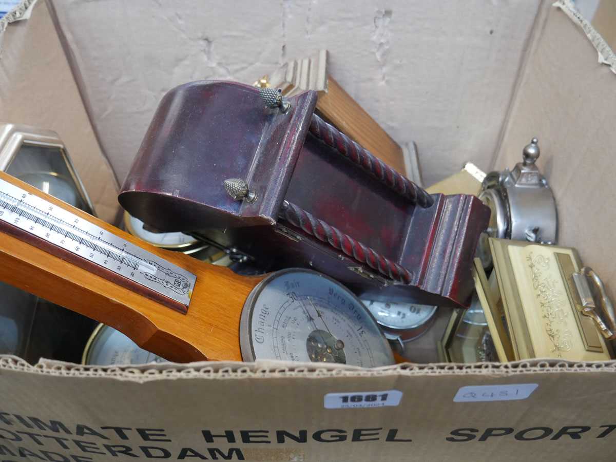 Box containing various clocks and barometers