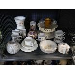 Cage containing various Royal Worcester cups, Wedgewood Peter Rabbit bowls, money boxes and other