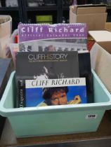 Plastic tub containing various Cliff Richard calendars and books